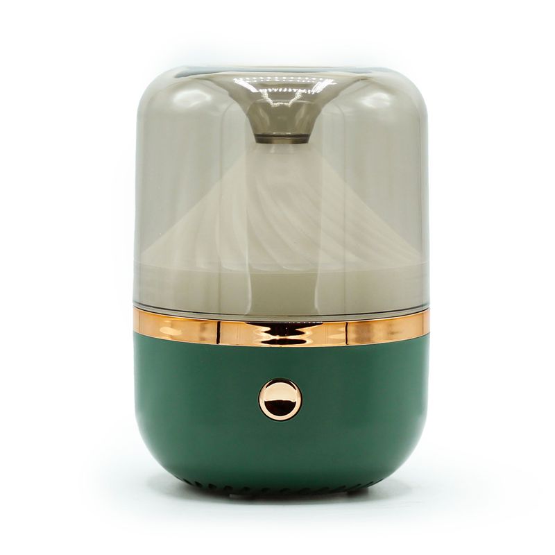 Difusor de aromas con depósito translúcido, base verde oscuro y anillo de color bronce