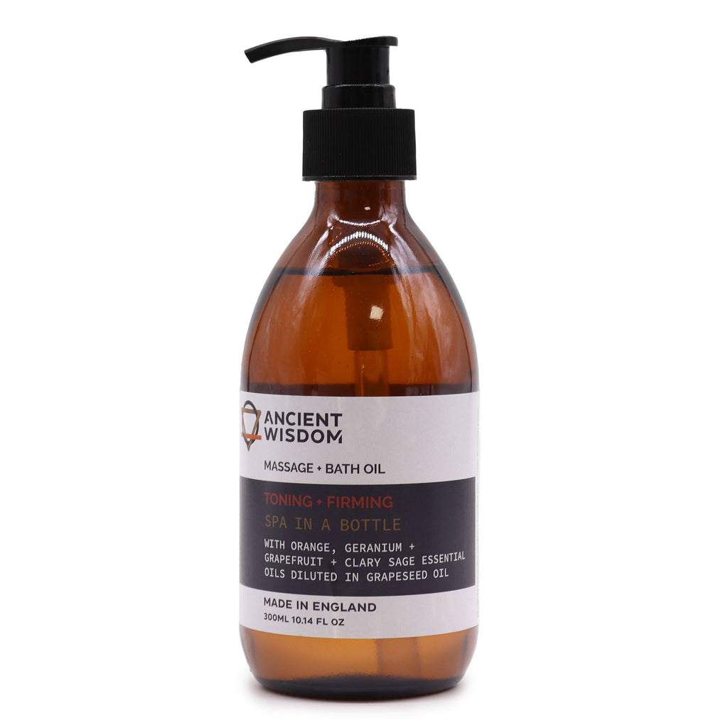 Botella de cristal ámbar con dosificador negro de aceite de masaje y baño Cítrico