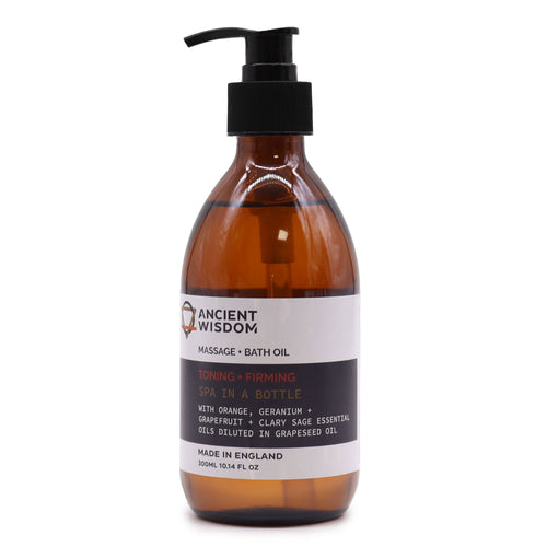 Botella de cristal ámbar con dosificador negro de aceite de masaje y baño Cítrico